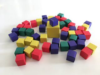 Yellow, red, green and blue paper cubes